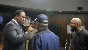 Mayor Butts talking with residents after council meeting. 